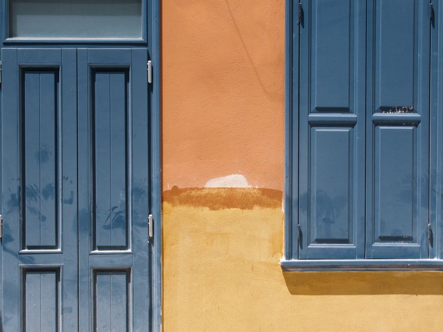 Exterior of a house showing painted siding and trim