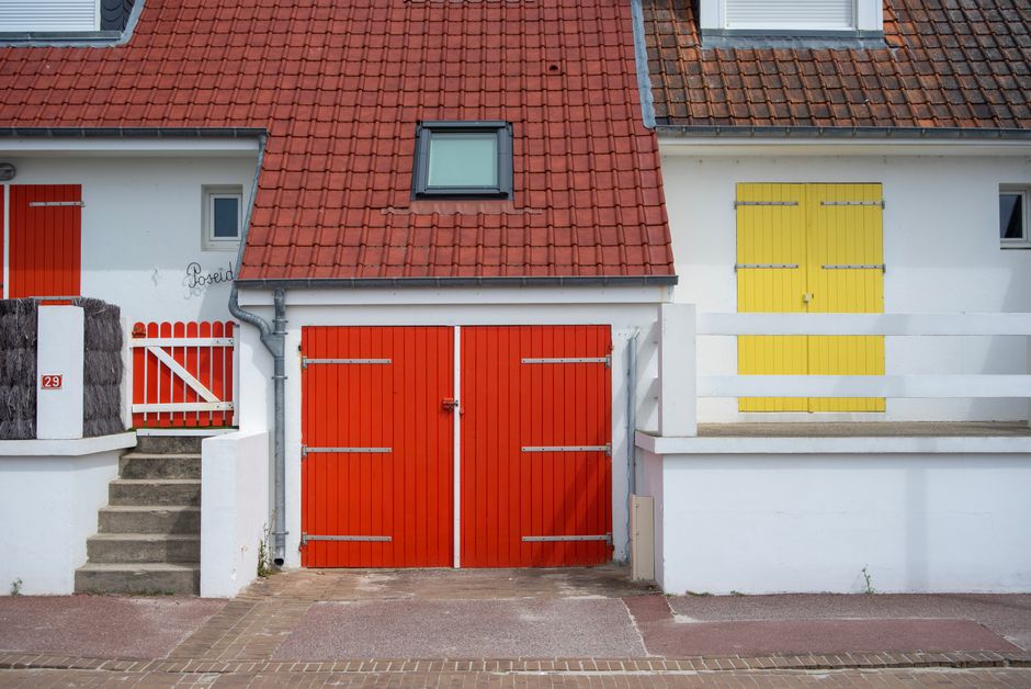 House facade with a freshly painted wall and door