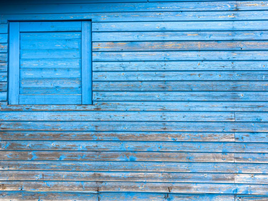 House facade with a freshly painted wall and door